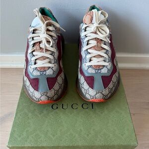 Gucci Rhyton sneakers in the popular beige and brick red colorway.